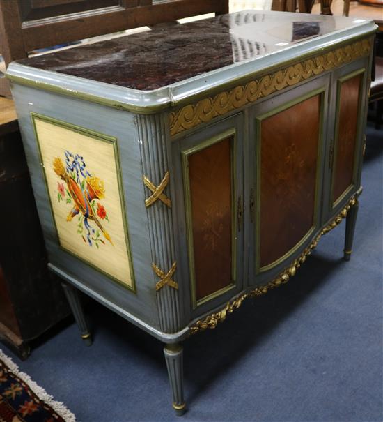 A French painted and marquetry inlaid cabinet, W.111cm